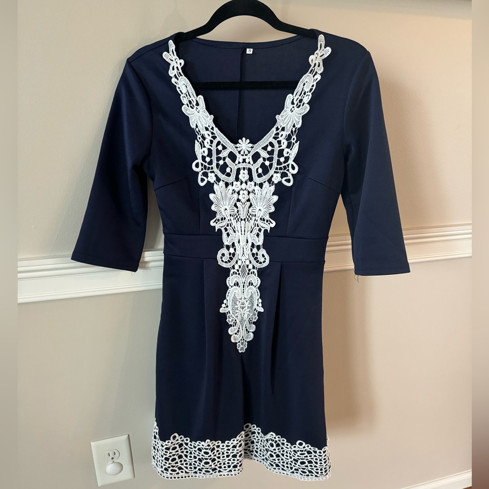 NWOT! Small, navy dress with white embroidery detail. Fit and flare